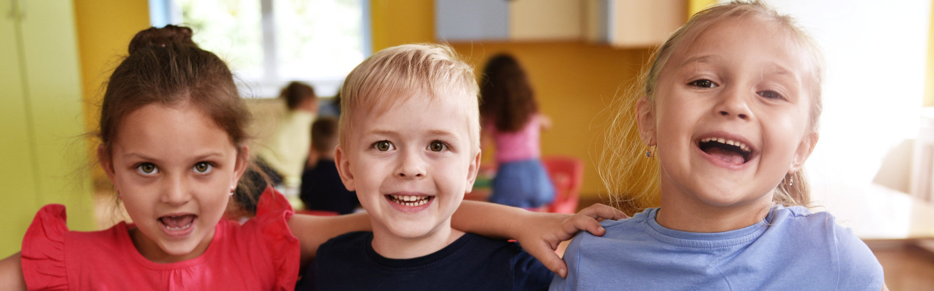 three kids smiling